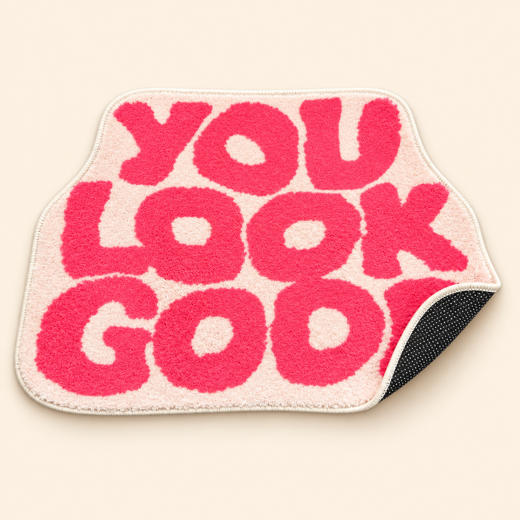 Pink You Look Good bath mat showing its soft top and dotted non-slip backing