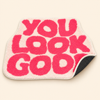 Pink You Look Good bath mat showing its soft top and dotted non-slip backing